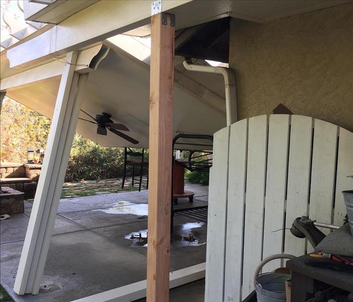 collapsed patio from storm  